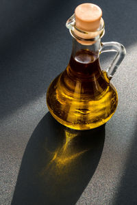 High angle view of glass bottle on table