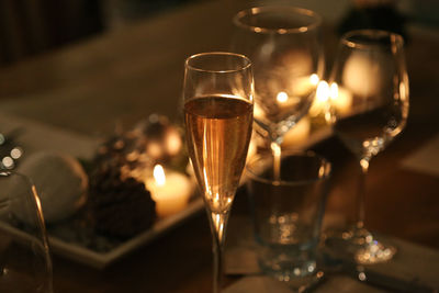 Close-up of wine glasses on table