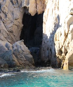 Scenic view of sea by rocks