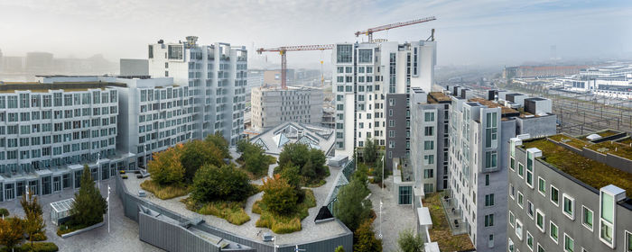 High angle view of buildings in city against sky