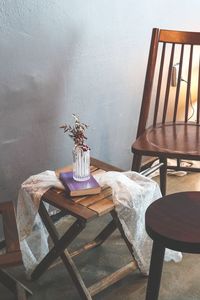 Empty chairs and table against wall at home