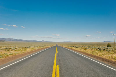 Views of an empty open road in oregon during a summer road trip.