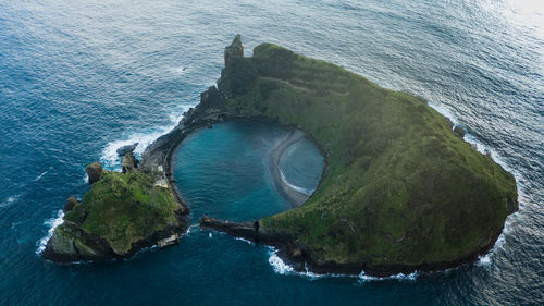 High angle view of rock formation in sea