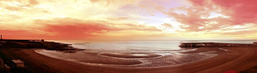 Scenic view of sea at sunset