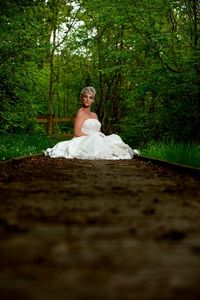 Portrait of a young woman sitting in forest