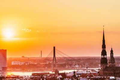 View of suspension bridge against sky during sunset