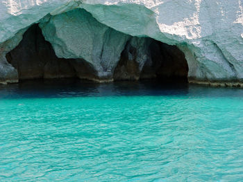 Caves in turquoise sea