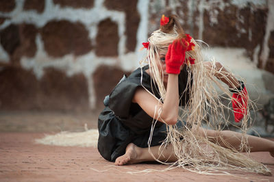 Woman sitting in traditional clothing