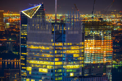 Illuminated buildings in city at night