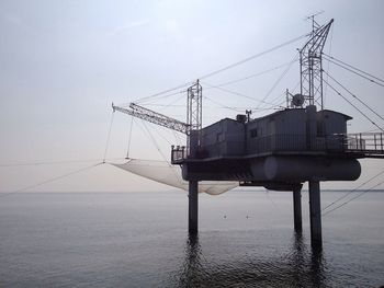 View of commercial dock against sky