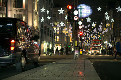 Decorated city street at night during christmas