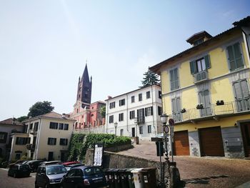 Residential buildings in city against sky