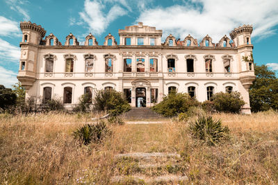 Facade of historic building against sky