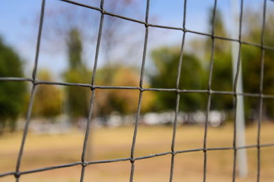 Close-up of valleyball field een through net