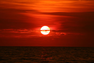 Scenic view of sea against romantic sky at sunset