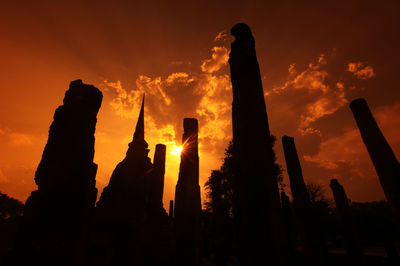 Low angle view of silhouette buddha statue