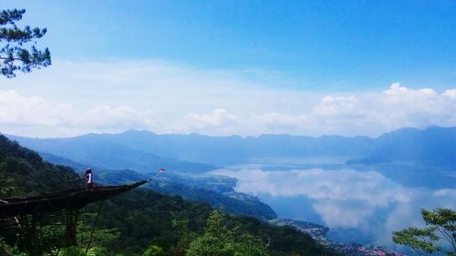 Scenic view of mountains against cloudy sky