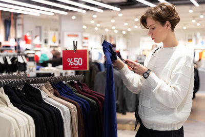 Woman shopping in clothing store