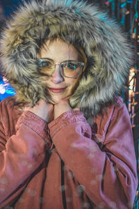 Portrait of smiling woman in snow