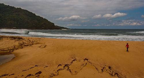 Scenic view of beach against sky