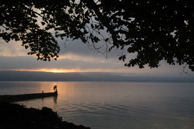 Scenic view of sea against sky at sunset