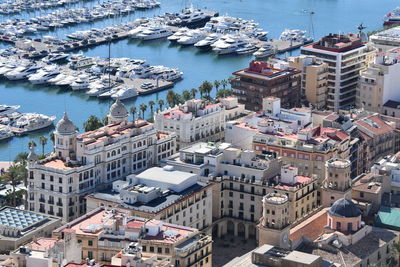 High angle view of sea and buildings in city