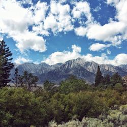 Scenic view of mountains against cloudy sky