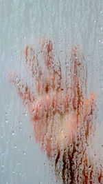 Hand under the steam of the shower