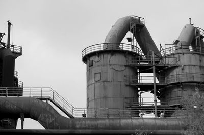 Low angle view of factory against clear sky