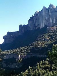 Scenic view of mountains against clear blue sky