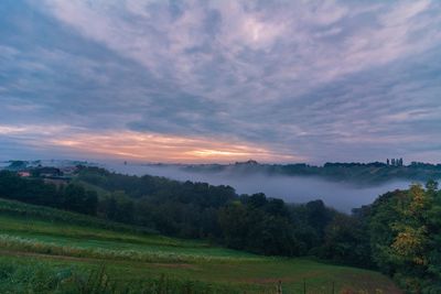 Scenic view of landscape against sky during sunset