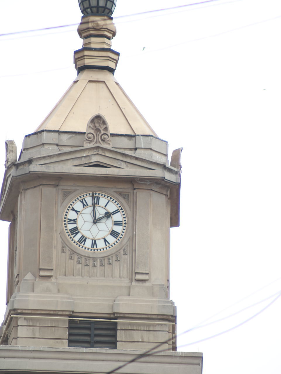 LOW ANGLE VIEW OF CLOCK TOWER ON BUILDING