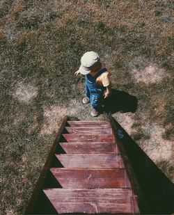 Full length of woman standing by railing