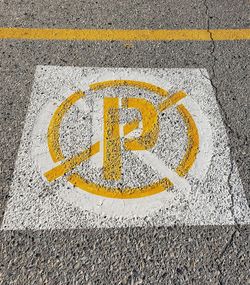 High angle view of arrow sign on road