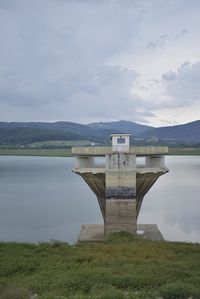 Bridge over lake against sky