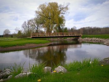 Scenic view of lake against cloudy sky