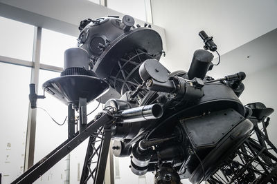Low angle view of wheel against sky