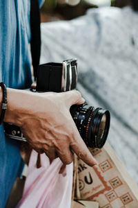 Close-up of man holding camera