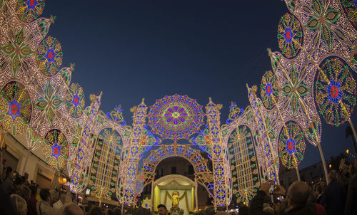 Low angle view of illuminated lights at night