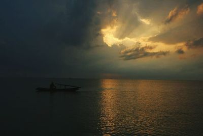 Scenic view of sea against dramatic sky