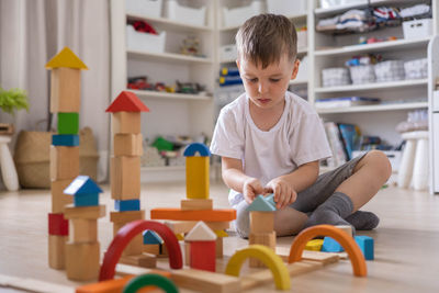 Boy playing with toy blocks