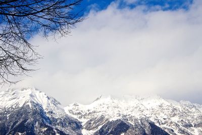 Scenic view of snow covered mountains against sky