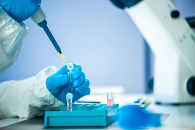 Cropped hands of scientist experimenting at laboratory