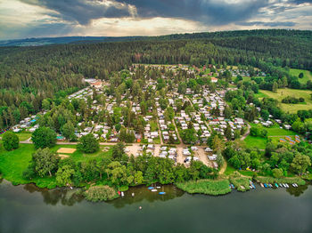 Aerial view of lake by landscape against sky