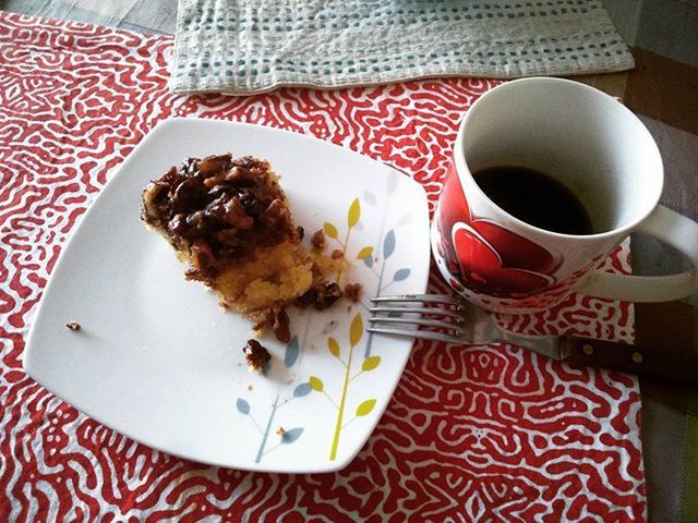 food and drink, indoors, coffee cup, freshness, table, drink, refreshment, still life, coffee - drink, plate, food, saucer, ready-to-eat, breakfast, cup, high angle view, coffee, spoon, sweet food, serving size