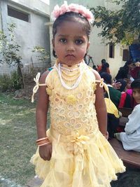 Portrait of cute girl standing outdoors