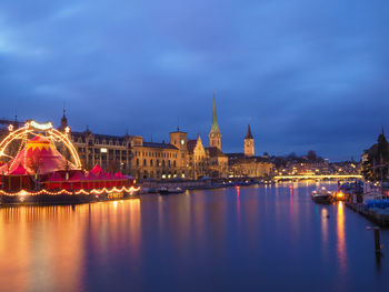 Illuminated city at waterfront