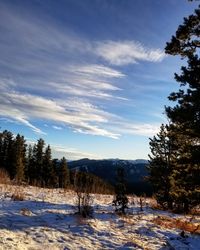 Scenic view of snow covered landscape against sky