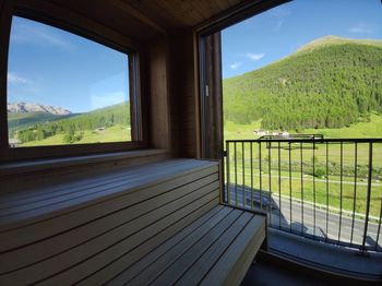 Scenic view of mountains seen through window