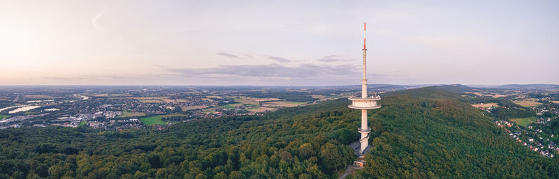 Aerial view of trees and buildings against sky